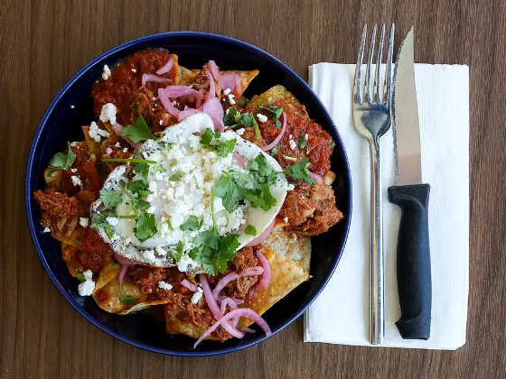 Chilaquiles rojos with fried eggs
